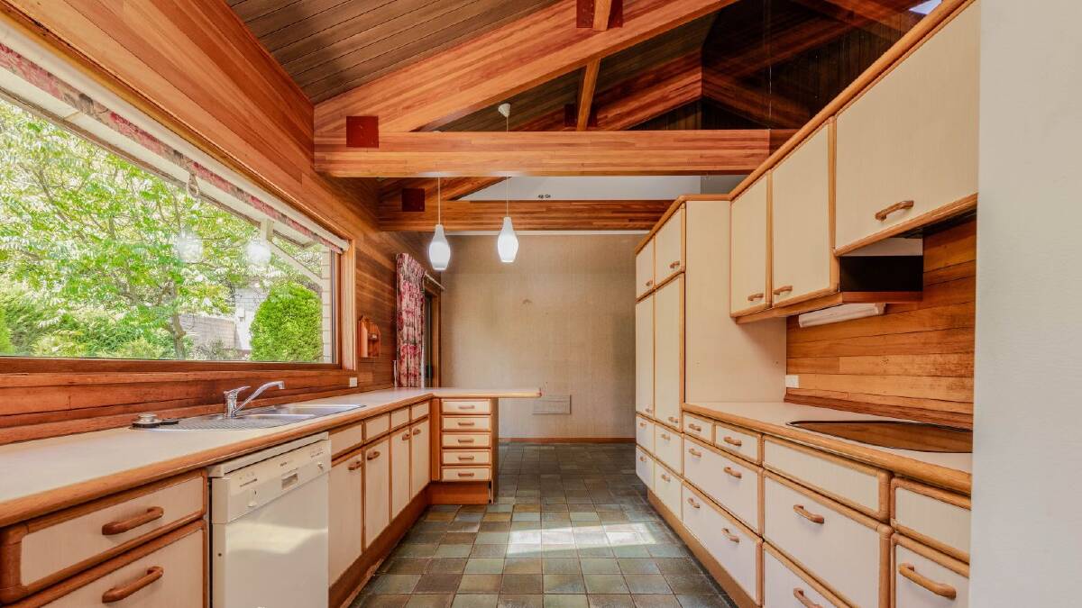 The 1970s Garran home featured strong timber accents. Picture supplied