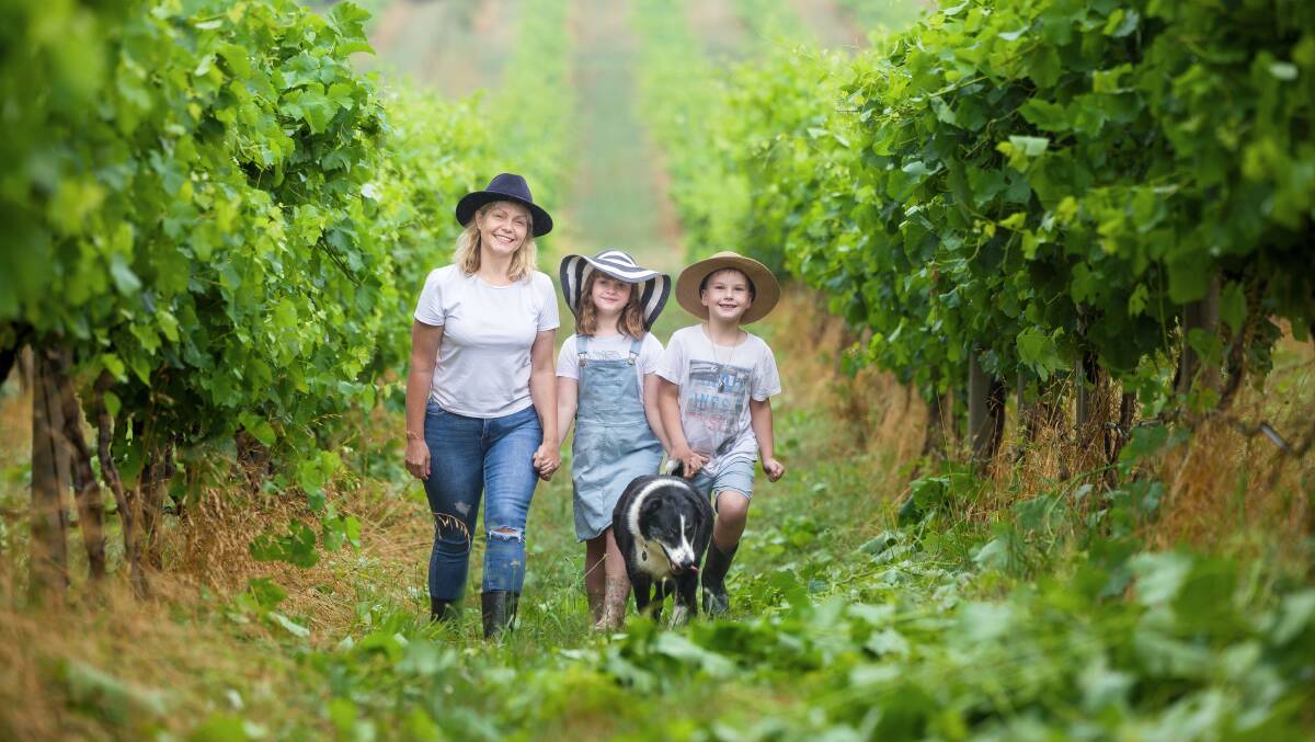 Lake George Winery owner Sarah McDougall with her children Eloise and Ryder and dog Pepper. Picture by Sitthixay Ditthavong