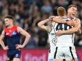 If form is anything to go by, Carlton and the Dees are preparing to fight out another MCG thriller. (James Ross/AAP PHOTOS)